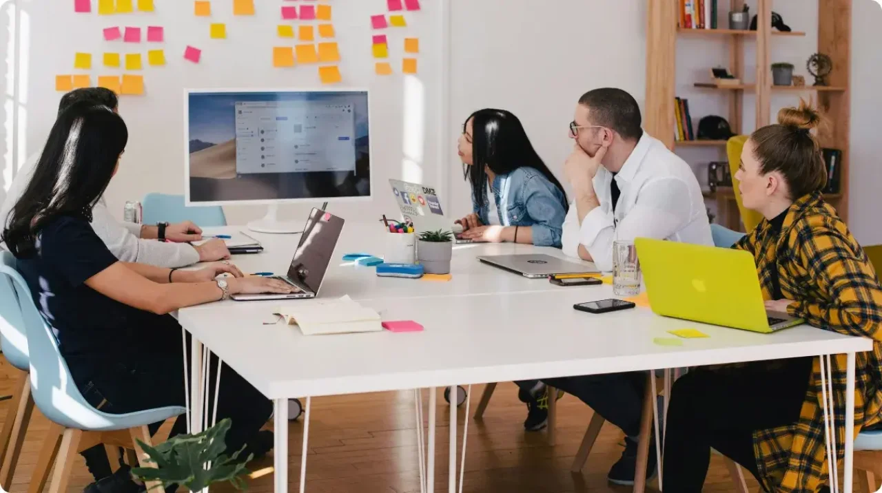 Five people in a work meeting