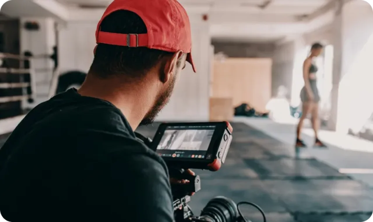Man Taking Photo Of Woman At The Gym