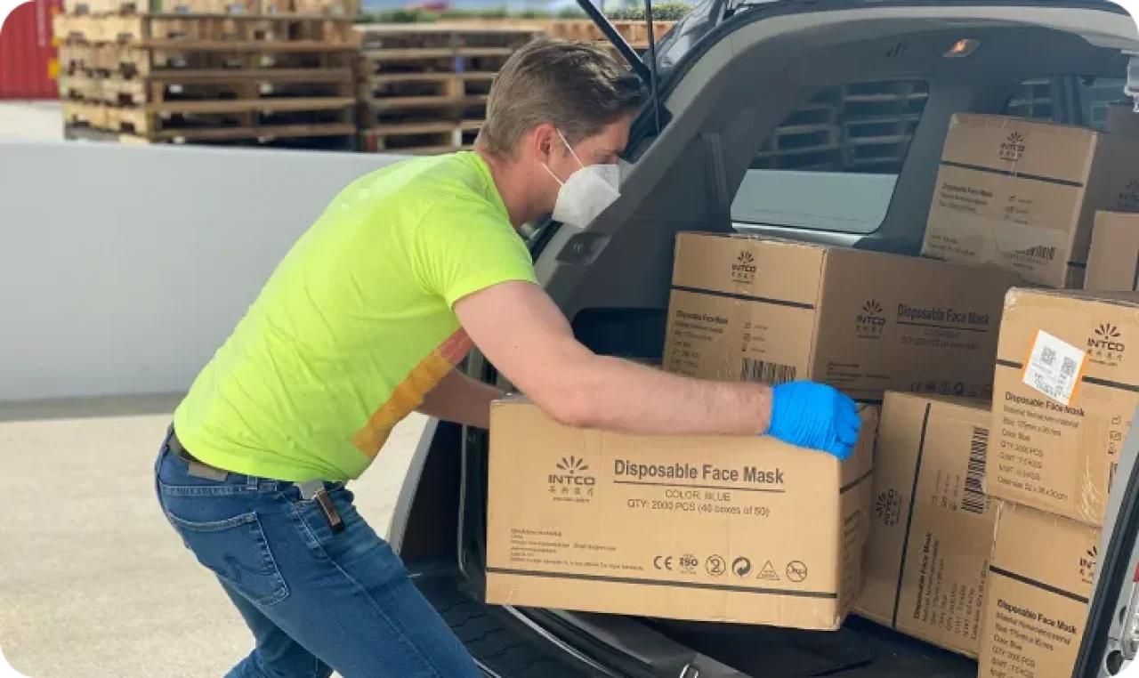 Man In Green T Shirt And Blue Denim Jeans Holding