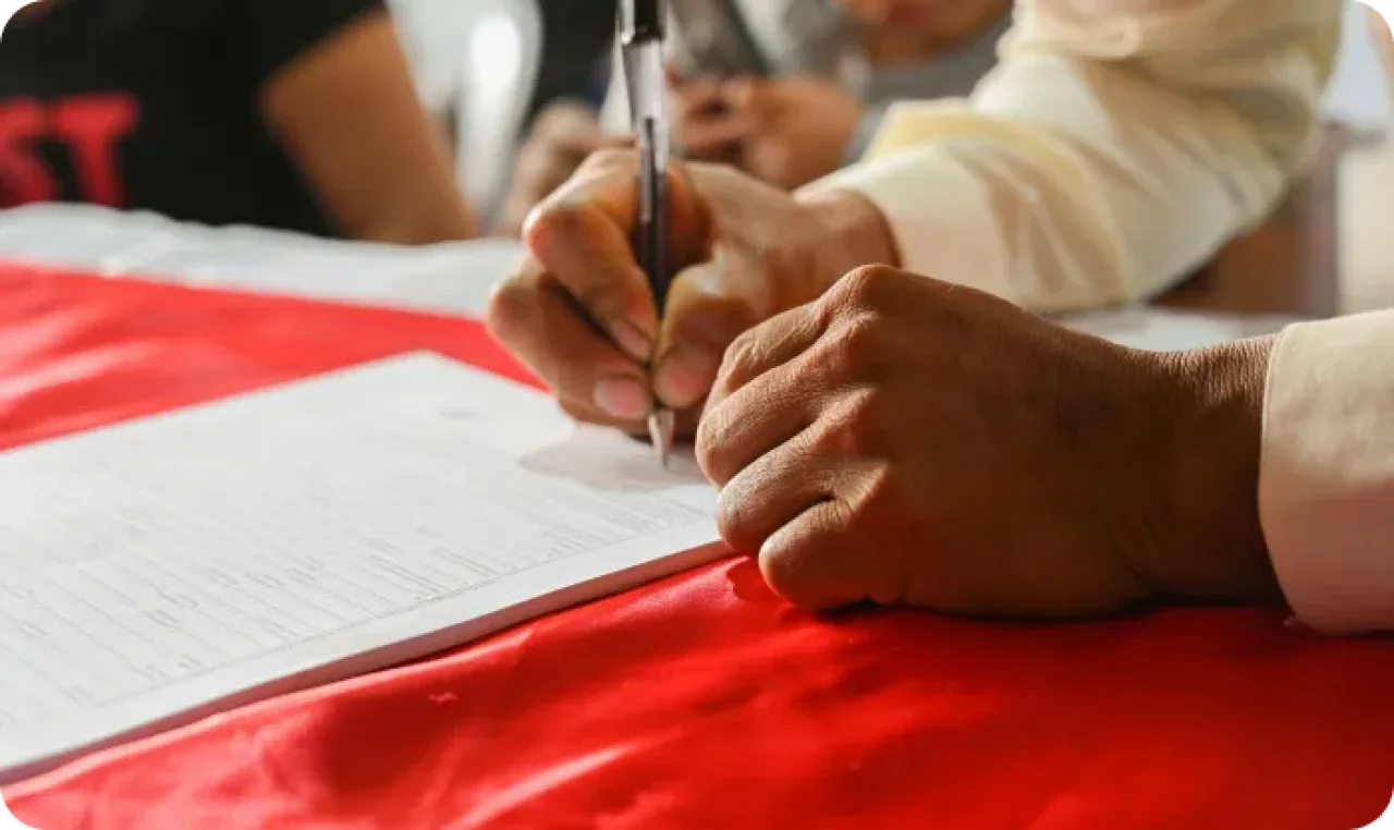 Man Signing Document