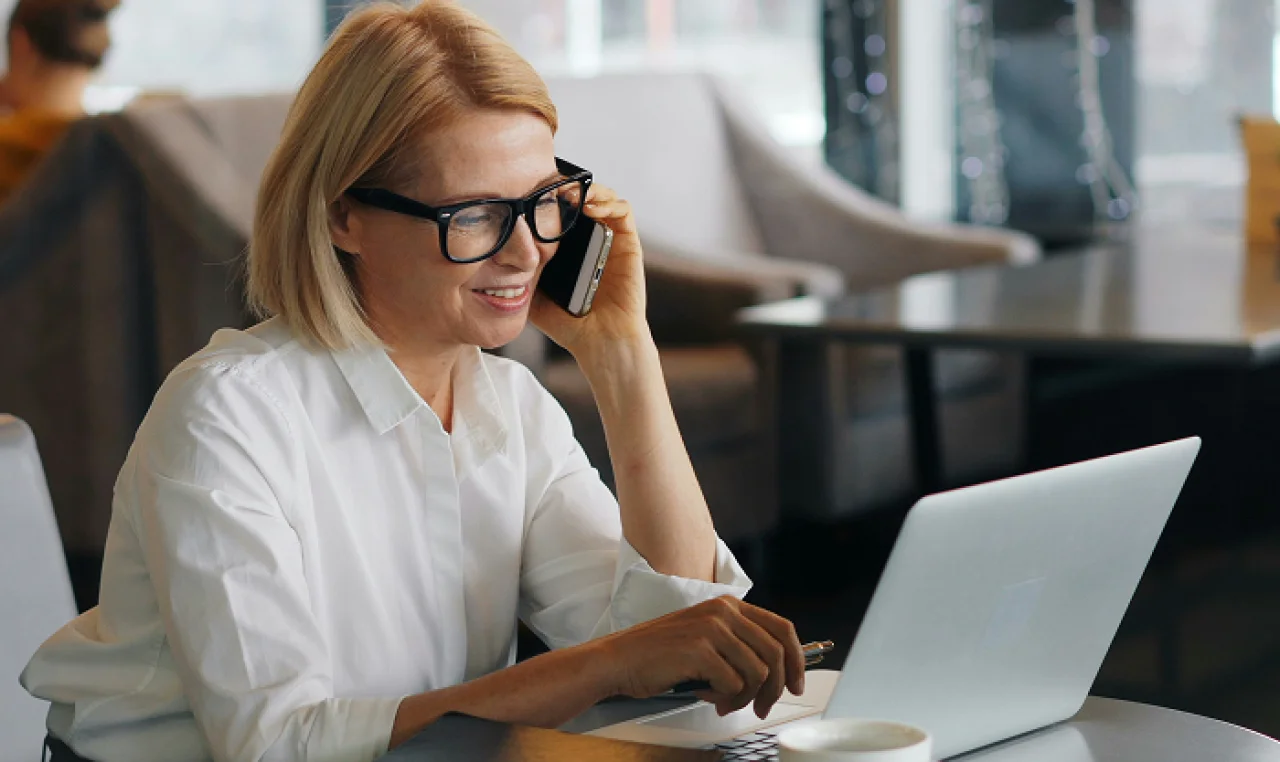 Bootstrapped business owner organizing receipts, using accounting software, and reviewing tax documents to keep finances clean and avoid IRS audits.