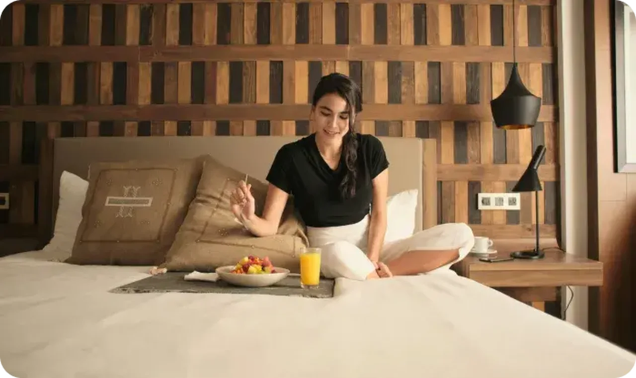 Woman Enjoying Breakfast In Cozy Hotel Room 1767032167