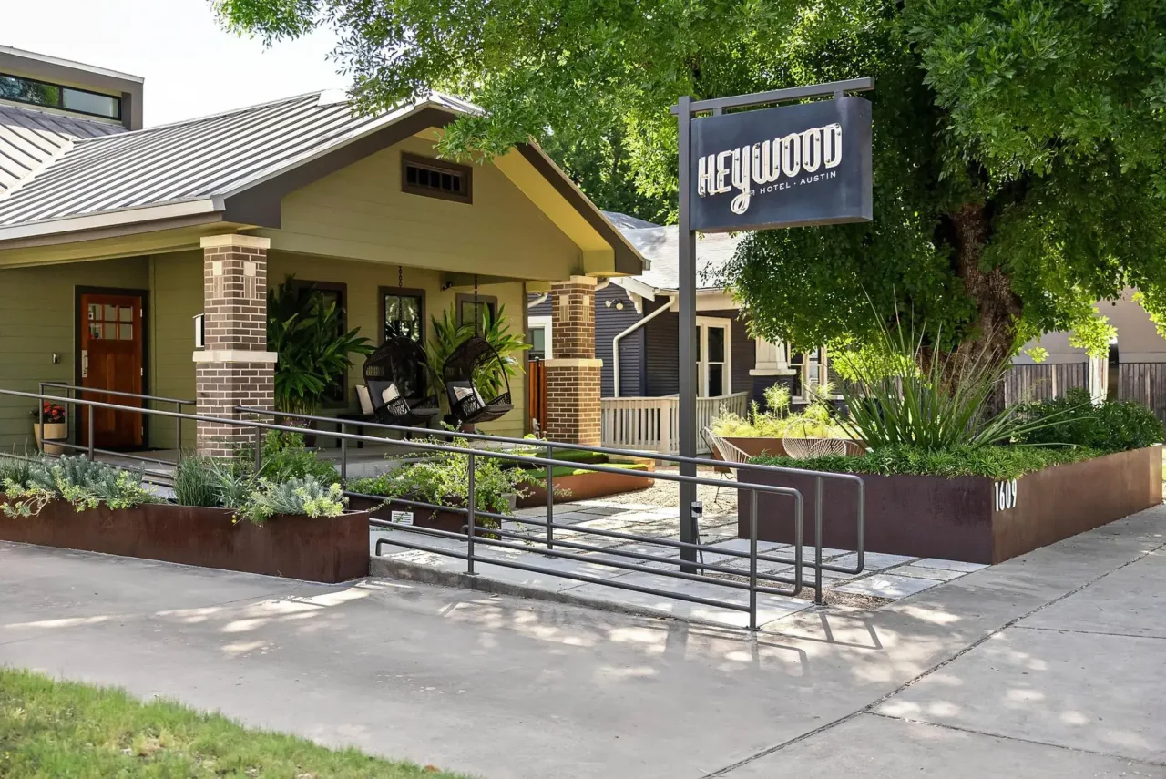 A small green house called the Heywood Hotel