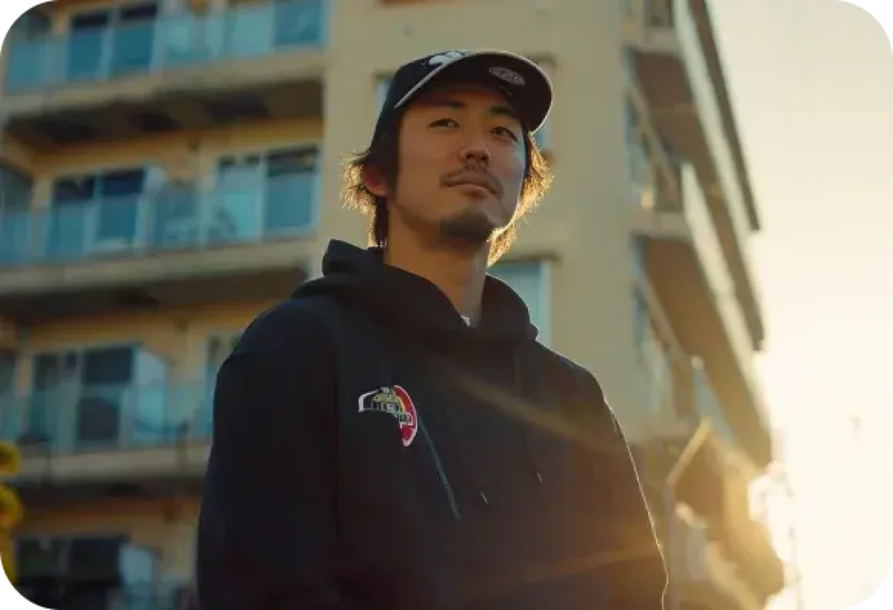 Man In Black Hoodie And Black Cap Standing
