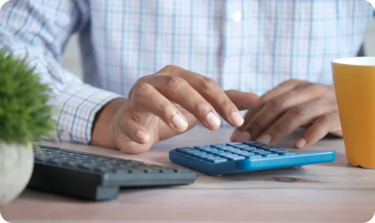 Man using blue calculator